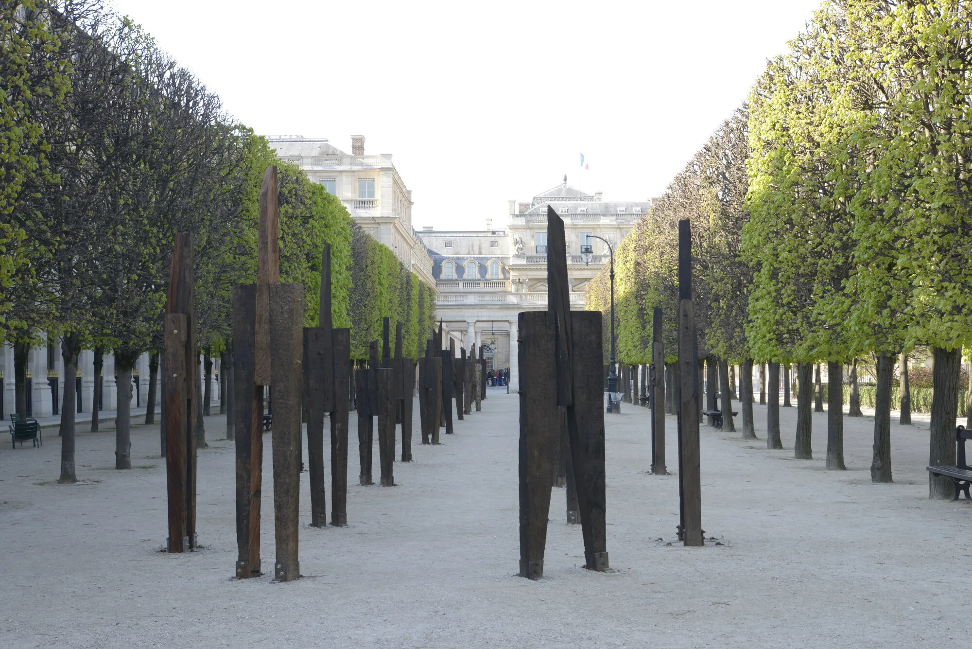 The Standing Man, 2016, railroad tie, H 250x340cm each, 48ea; installation at Jardin du Palais-Royal, Paris