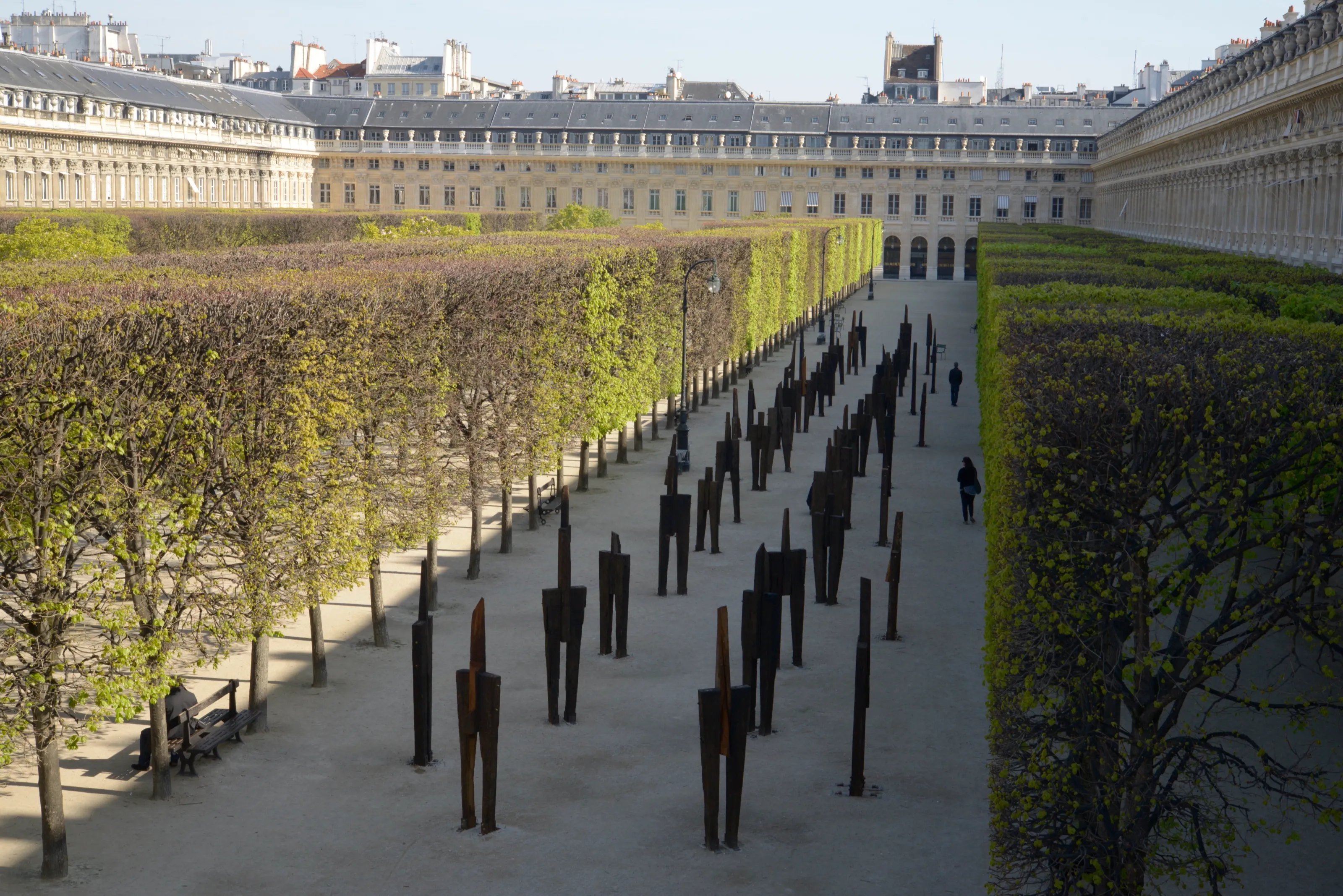 The Standing Man, 2016, railroad tie, H 250x340cm each, 48ea; installation at Jardin du Palais-Royal, Paris